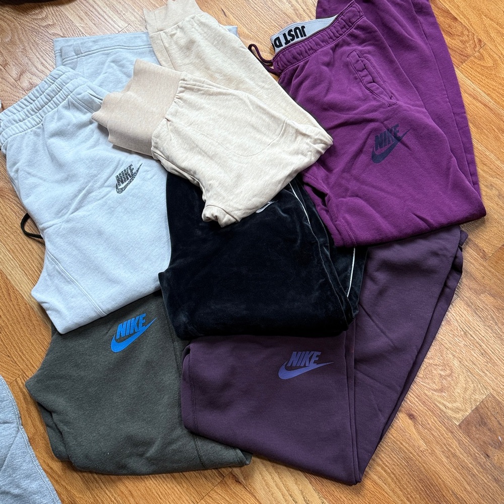 6 pairs Nike Sweatpants Assortment in Purple, Gray, and Black white